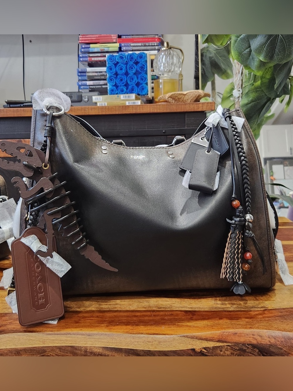 BNWT Coach Rogue 40 loved leather with ALL charms included.